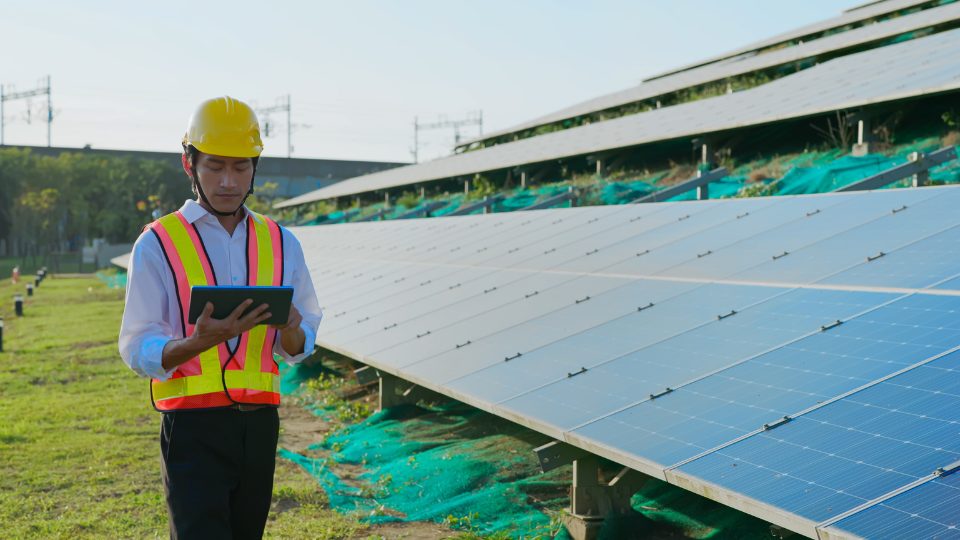 Man using tablet in energy sector technology solutions heropic